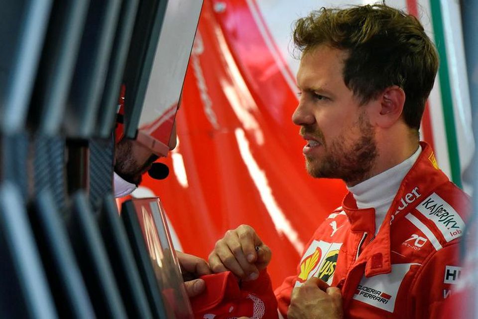 Sebastian Vettel í bílskúr Ferrari í Sotsjí í dag.