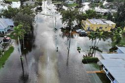 PUNTA GORDA - OCTOBER 10: In this aerial view, flood waters inundate a neighborhood after …