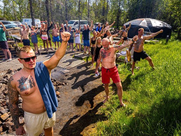 Before entering the sweat lodge, thanks are given to the directions, each of which has its own meaning. In the photo, participants face west and thank the elves and trolls for assisting them in the day&#8217;s sweat.
