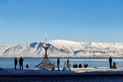 Tourists by the sculpture The Sun Voyager by Jón Gunnar Árnason by Sæbraut in Reykjavík …