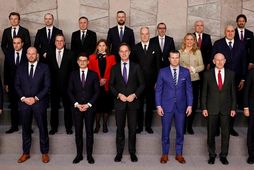 The man in the blue jacket in front of Gunnarsdóttir is the US Secretary of …