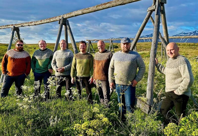 In Hrísey &#8211; The knitting men in their new sweaters, from left: Narfi Freyr Narfason, Noël Legatelois, Almar Björnsson, Sigfús Páll Sigfússon, Narfi Björgvinsson, Gestur Leó Gíslason, and Guðmundur Stefánsson.