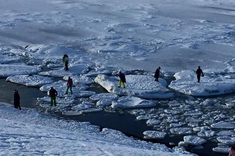 Irresponsible tourists iceberg-hopping in Iceland.