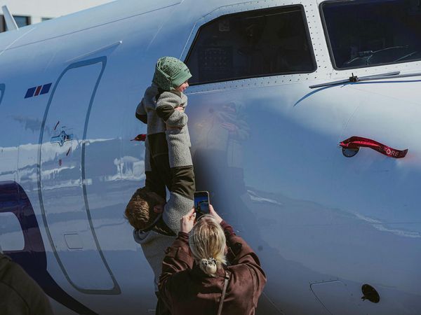 The children enjoyed looking at the airplanes.