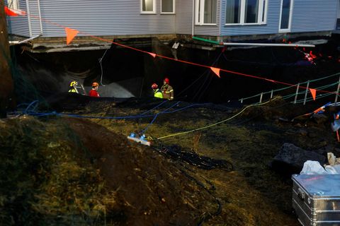 Rescue workers at work at Grindavík this morning.