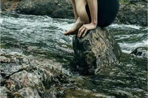 Adelaide wearing a black swimsuit from Icelandic designer Eygló.