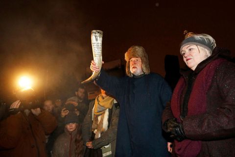 Hilmar Örn Hilmarsson carrying a drinking horn at the Winter Solstice ceremony last night.