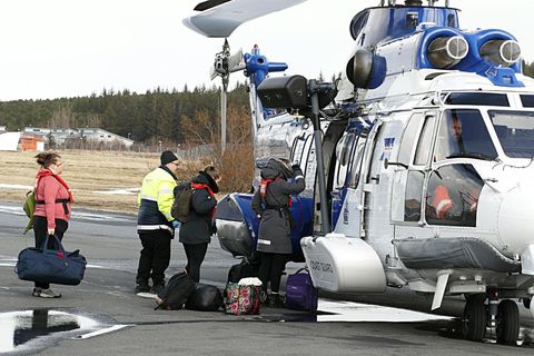 Health care workers, boarding the Icelandic Coast Guard helicopter.