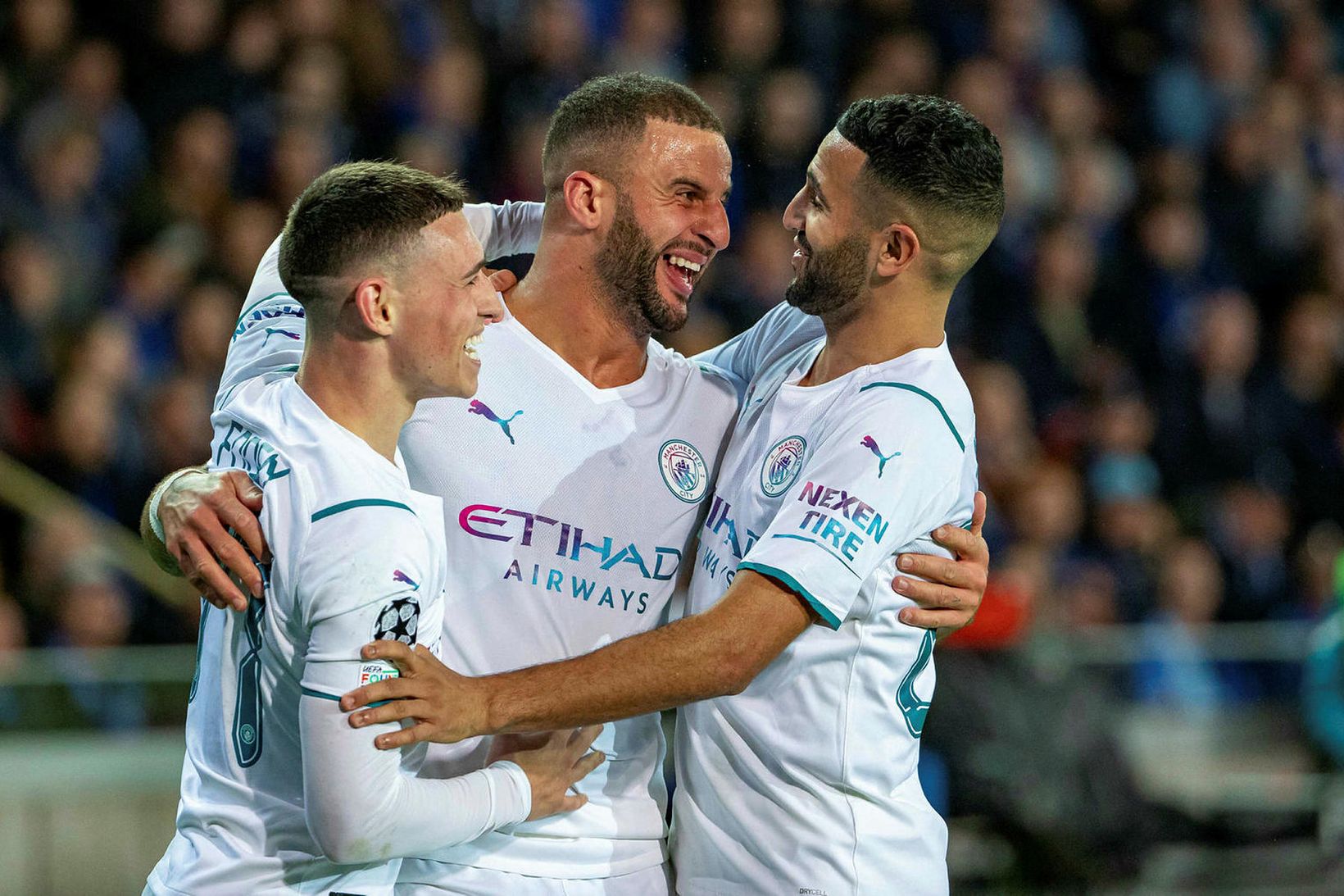 Phil Foden, Kyle Walker og Riyad Mahrez fagna einu af …