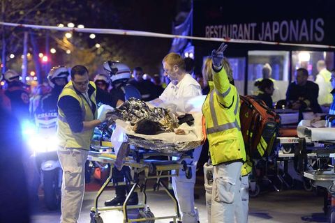 Paramedics at one of scenes of Friday night's terrorist attacks.
