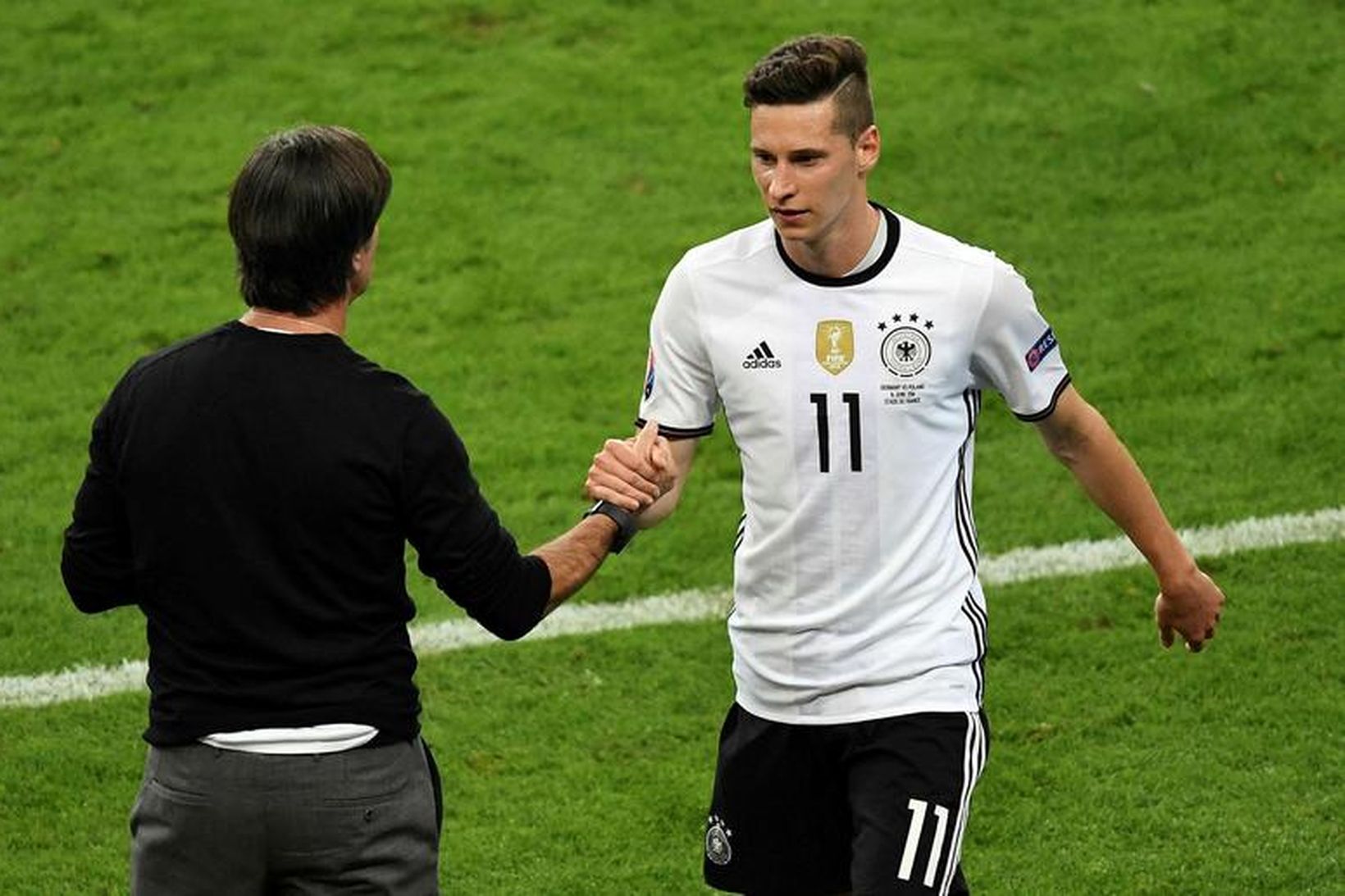 Julian Draxler, leikmaður þýska landsliðsins í knattspynu, og Joachim Löw, …