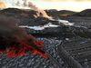 The lava is right next to the car park and will probably flow over it soon.