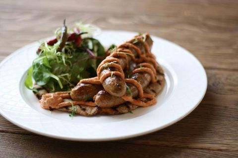 Merguez on sourdough bread with harissa sauce.