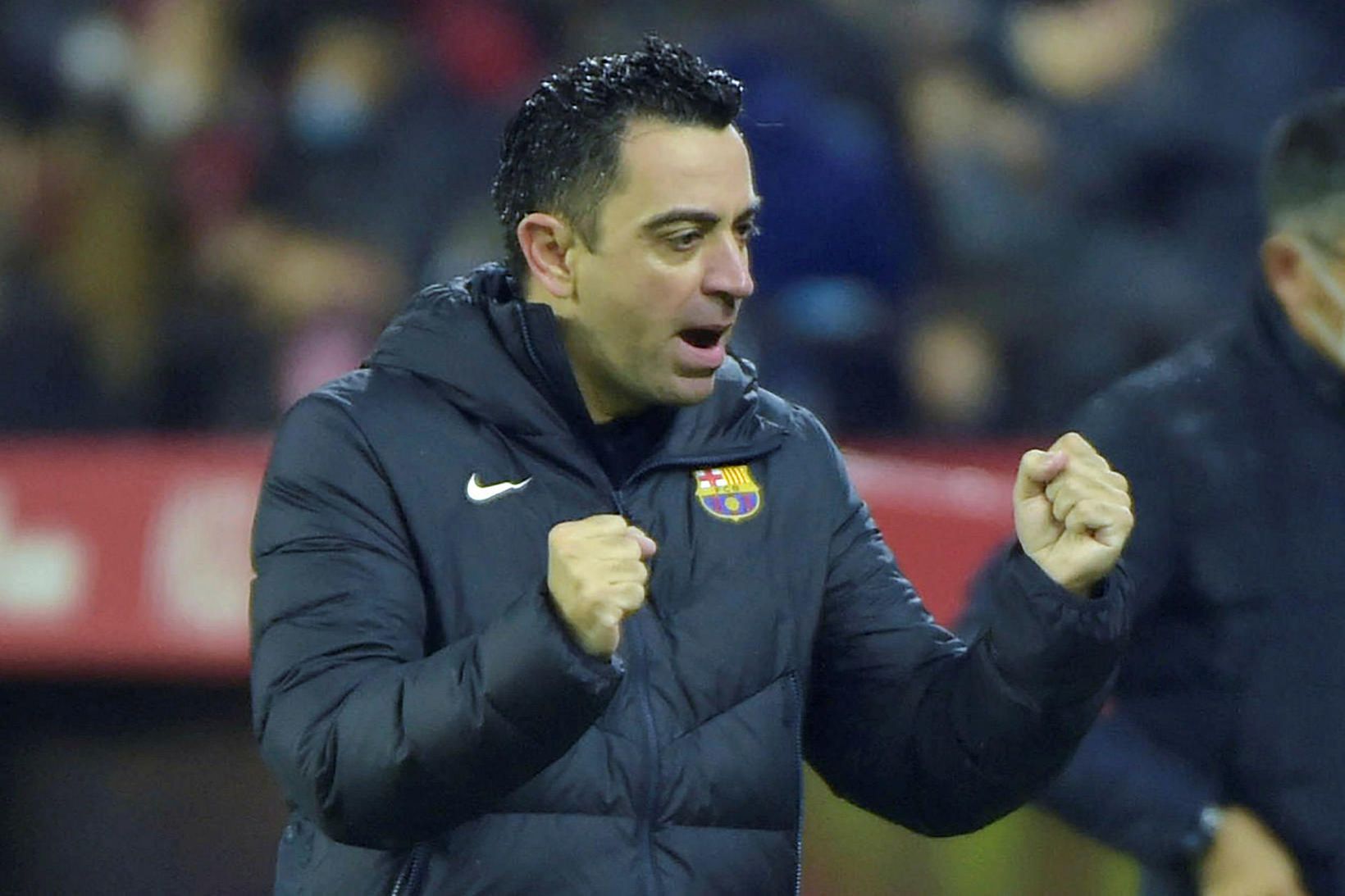 Xavi fagnar marki Barcelona í kvöld.