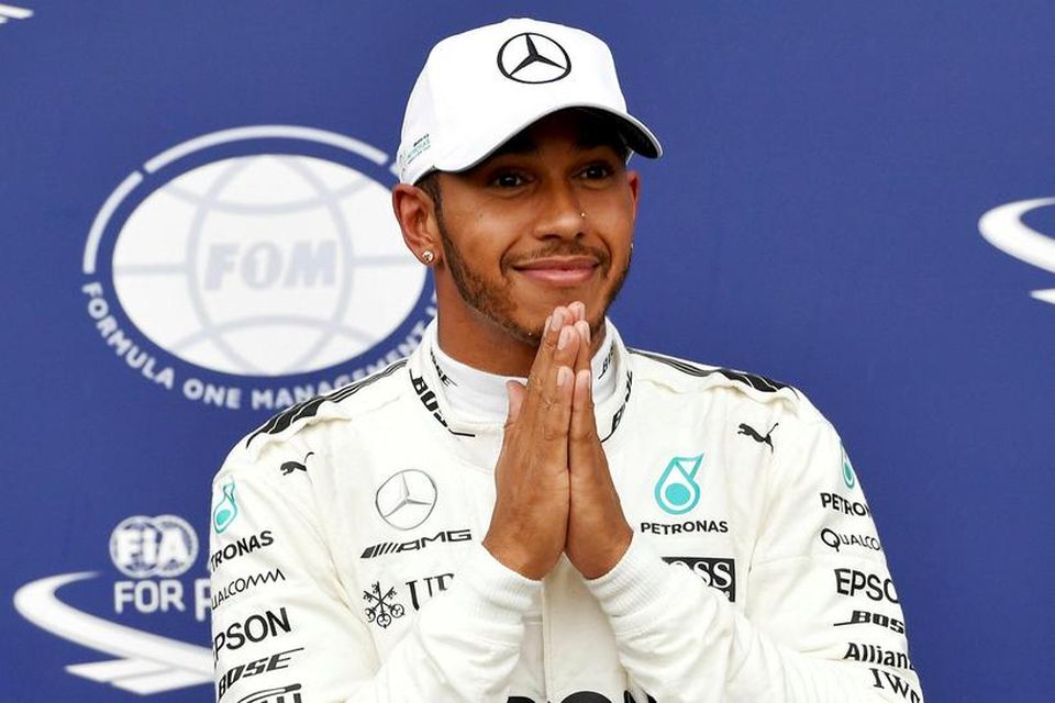 Lewis Hamilton fagnar metpólnum í Monza.