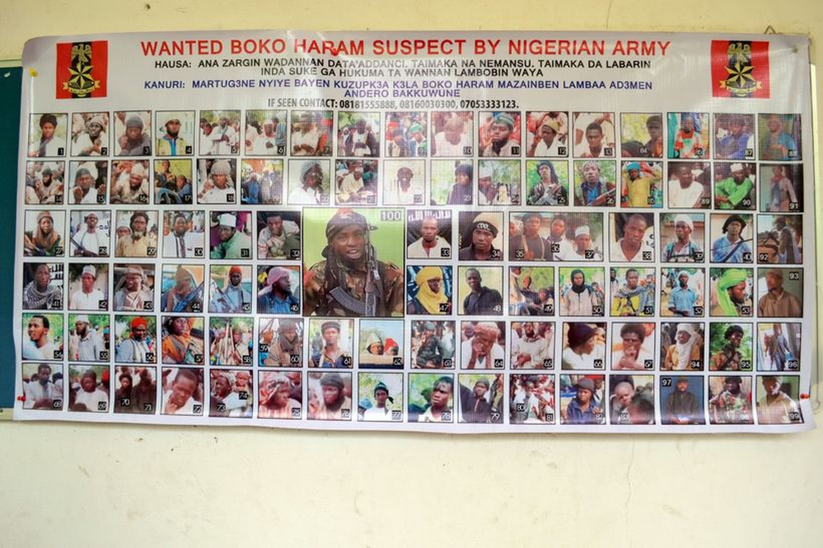 Veggspjald sem sýnir eftirlýsta vígamenn Boko Haram í Nígeríu.