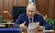 Vladimír Pútín talar á fundi um efnahagsmál í fyrradag, en á fundi með sínum æðstu …
