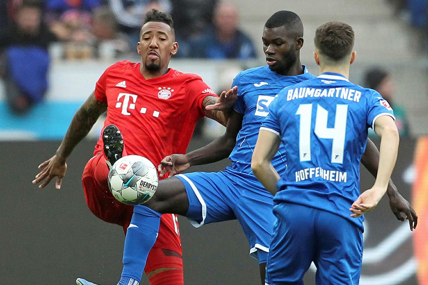 Jeróme Boateng, til vinstri, í leik með Bayern gegn Hoffenheim.