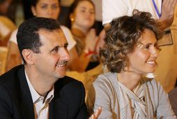 Asma al-Assad ásamt eiginmanni sínum og fyrrum Sýrlandsforseta, Bashar al-Assad.