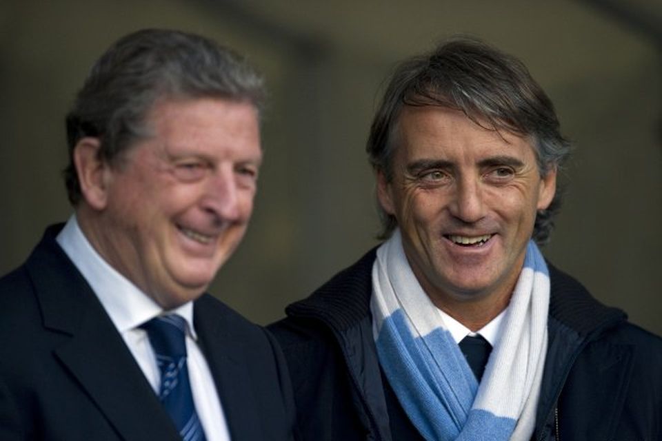 Roy Hodgson og Roberto Mancini, knattspyrnustjórar WBA og Man.City, ræða málin fyrir leik liðanna í …