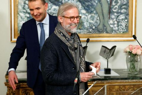 Ragnar Axelsson, RAX, receiving prize for best documentary book at the presidential residence. President Jóhannesson is with him in the photo.