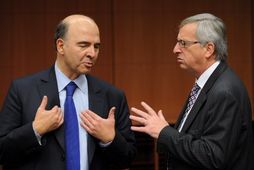 Pierre Moscovici, fjármálaráðherra Frakklands og forsætisráðherra Lúxemborgar, Jean-Claude Juncker, í Brussel í gær